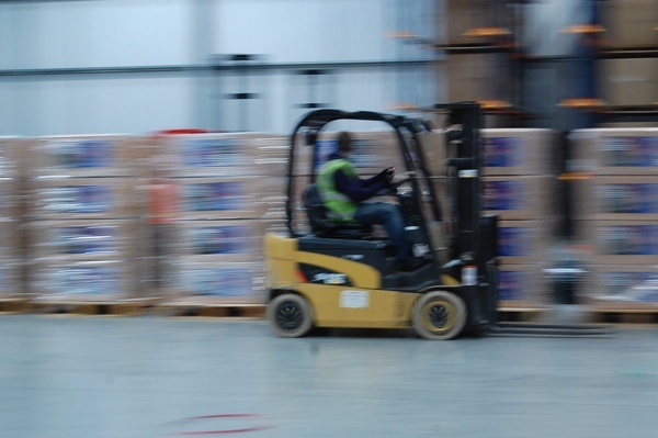 Forklift driving in a warehouse
